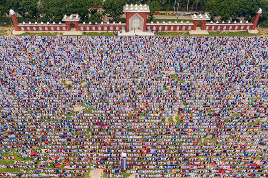 Aerial view of a vast crowd of people worshipping at Gore Shahid park in front of Eid Gah Minar religious site in Dinajpur, Rangpur, Bangladesh.