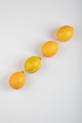 Fresh yellow lemons isolated on white background