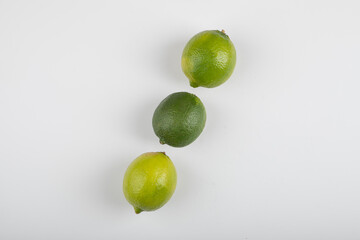 Three ripe lime fruits isolated on white background
