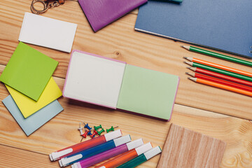 Obraz premium multicolored pencils work desk stationery notepad close up