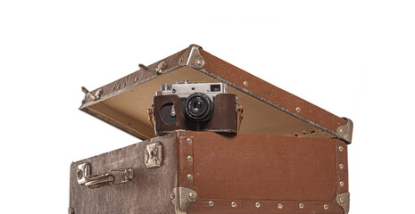 Old suitcase and old camera on white background.