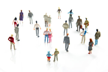 miniature people. different people stand on a white background. communication of society of different generations