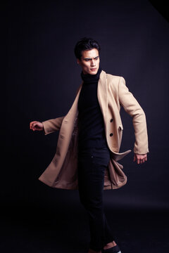 handsome asian fashion looking man posing in studio on black background, lifestyle modern people concept