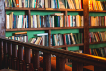 Old university college library interior with a bookshelves, books and bookcase, classic style school interior archive with wooden ladder