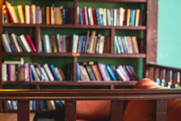 Old university college library interior with a bookshelves, books and bookcase, classic style...