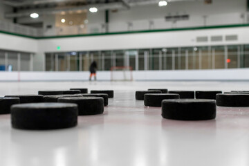 Hockey pucks on an ice rink