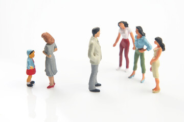 miniature people. concept of family people in relationships on a white background. the problem of fidelity in marriage. raising children in problematic relationships in the family.