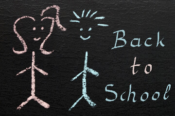 "back to school" - handwritten on a chalkboard 