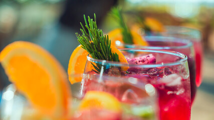close up of Group of Refreshing cocktails with ice and fruits of different flavors and colors in glass on the table on sunny day in front of the sea, beach party in Guanacaste Costa Rica © Vernny