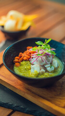 Plate of fresh Ceviche, bowl type with spices, unique dish and restaurant specialty, served at a table in front of the beach Guanacaste Costa Rica