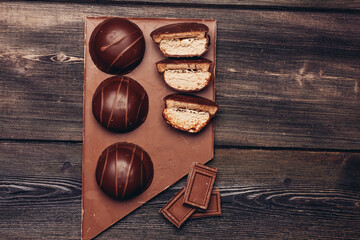 cakes on chocolate bar wooden background dessert delicacy texture