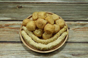 Pile of fried tofu and soft steamed tofu on the plate. Famous ingredient in Asia restaurant. High protein and low fat food. 