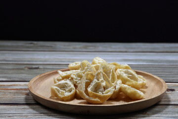 Pile of cutting deep fried tofu serving on the plate. Famous ingredient in Chinese food. High fiber and protein.