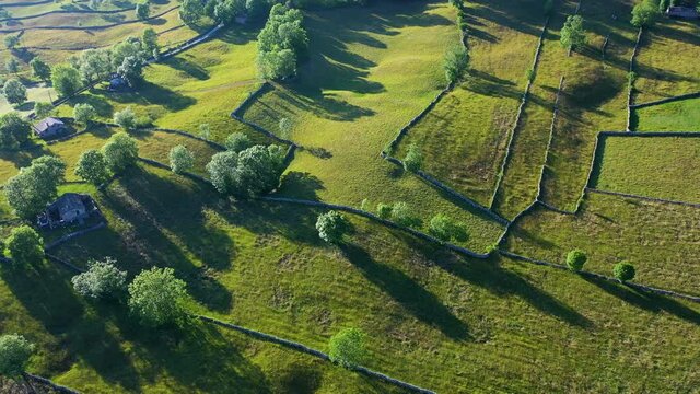 Landscape of meadows, Pasiegas Cabins and stone walls in the Portillo de la Sia. Comarca de Las Merindades in the province of Burgos. Autonomous Community of Castilla y Leon