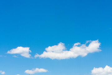 White clouds on blue sky background, copy space