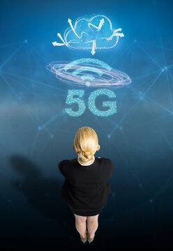 businesswoman with message 5G on abstract blue background