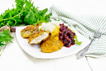 Turkey breast with cranberry sauce on light board