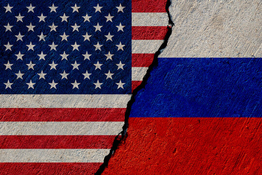 usa and russia flags painted on concrete wall