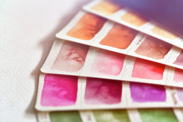 Close-up color palette in shades of pink, brown and orange.