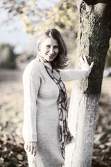 Young beautiful woman in the park close-up. Old black and white photo.