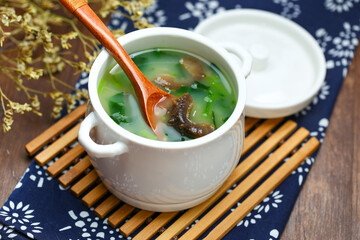 sea cucumber congee soup in white pot