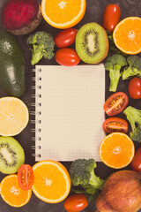 Vintage photo. Notepad for notes and fresh fruits with vegetables, slimming and healthy lifestyles concept