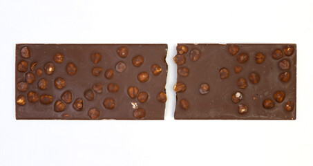 sweet and delicious whole chocolate bar is lying on white background, photo taken from above