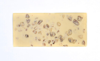 sweet and delicious whole chocolate bar is lying on white background, photo taken from above