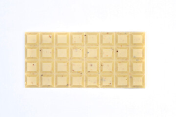 sweet and delicious whole chocolate bar is lying on white background, photo taken from above