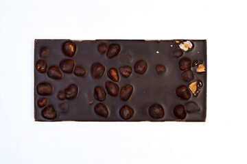 sweet and delicious whole chocolate bar is lying on white background, photo taken from above