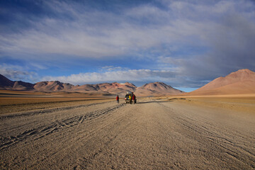 Tourists with the beautiful Palette of colors in the Salvador Dali Valley, Salar de Uyuni, Bolivia