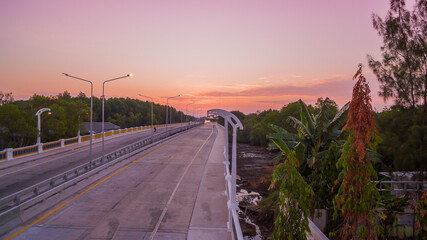 The sun rises over Thepsrisin Bridge. Thepsrisin Bridge is a shortcut to connect the city from Saphan Hin intersection with Sakdidet intersection in order to reduce the bad traffic congestion..