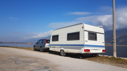 caravan trailer by the lake of Ioannina in winter - obrazy, fototapety, plakaty