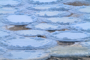 loosely frozen ice floes on the river