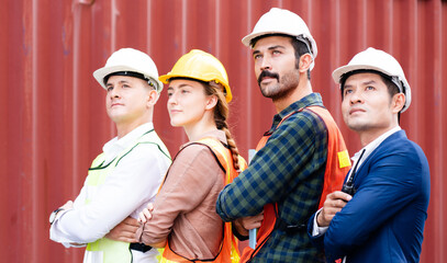 Happiness of labor group and workers. Teamwork and determination to succeed. Safety helmet to prevent accidents while working. Transport and Container Team. Concept key worker