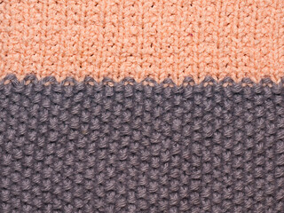 Fototapeta premium Multicolored ornament knitted from woolen threads. 
