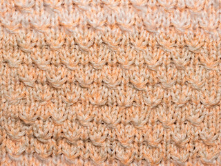 Multicolored ornament knitted from woolen threads. 