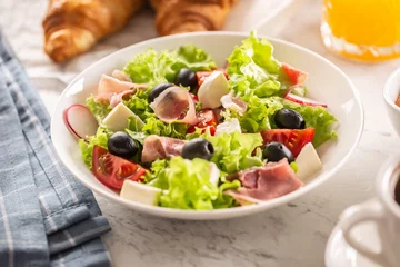 Abwaschbare Fototapete Healthy salad in a bowl with olives, raddishes, tomato, cheese and lean ham served for breakfast © weyo