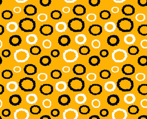 Abstract geometrical circle pattern with yellow background.