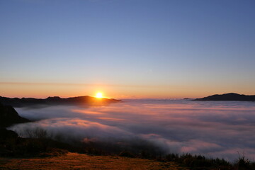 Majestic misty valley landscape during golden sunrise