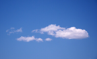 Close-up of floating white clouds in the blue sky