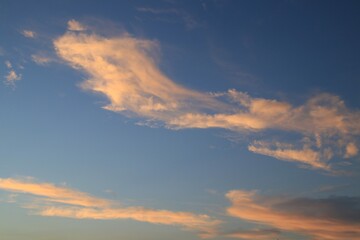 Naklejka na ściany i meble Beautiful sunset clouds in blue sky