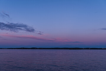 Fototapeta na wymiar Colorful sky and lake after sunset; beautiful horizon