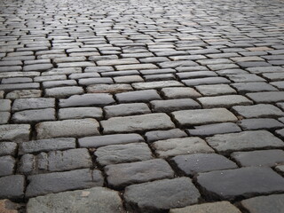 dirty gray cobbled road perspective