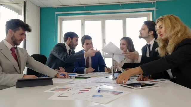 business, finance - manager gives the new collaborators the consultancy contract