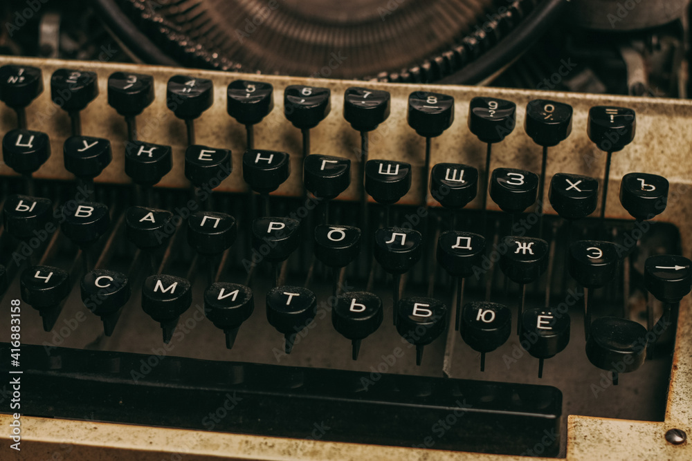 Fototapete typewriter with keys on a wooden background retro style close-up macro