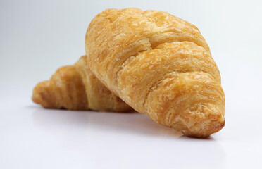 Fresh tasty croissants on white background. French pastry