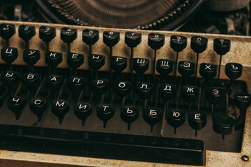 typewriter with keys on a wooden background retro style close-up macro