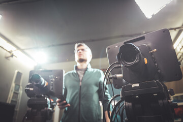 Cameraman operates a film camera, broadcasting recording studio