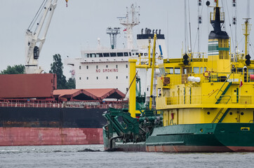 HOPPER DREDGER - A specialized vessel works on the fairway in the port